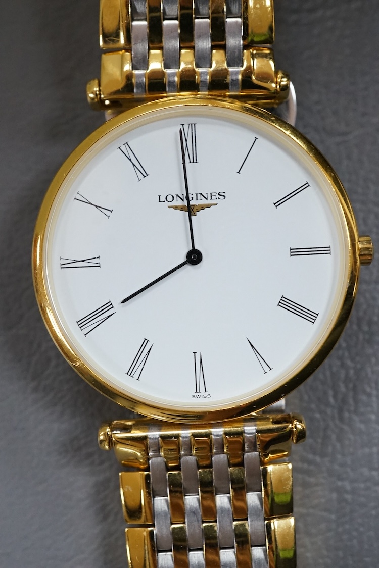 A gentleman's gtwo tone gilt steel Longines L4709-2 Le Grand Classique quartz dress wrist watch, with Roman dial, case diameter 33mm, boxed